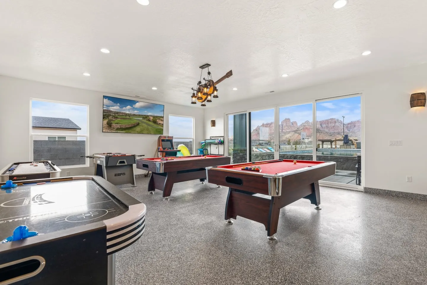 Game room with a pool table and air hockey table