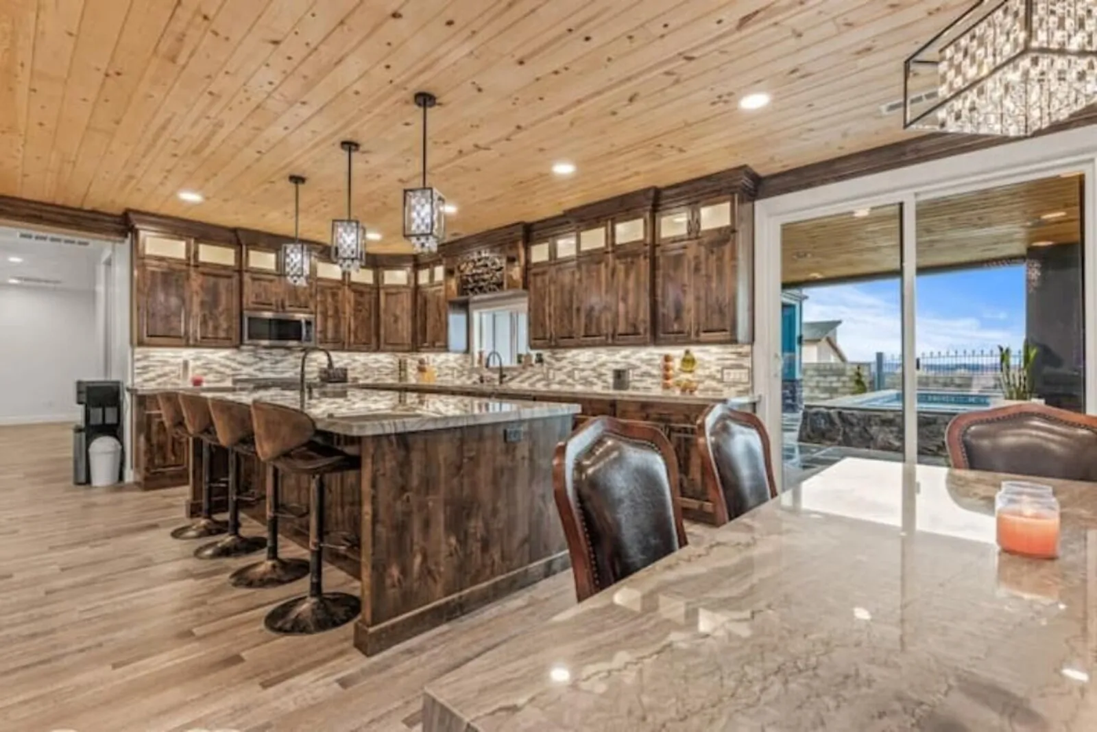 Kitchen island with bar seating next to the dining table