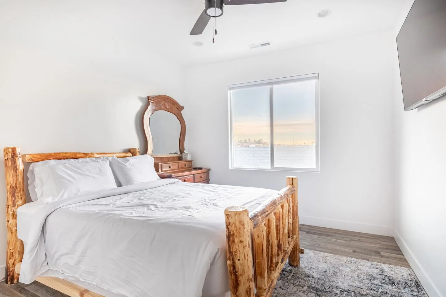 Bedroom with a log-frame bed and a dresser