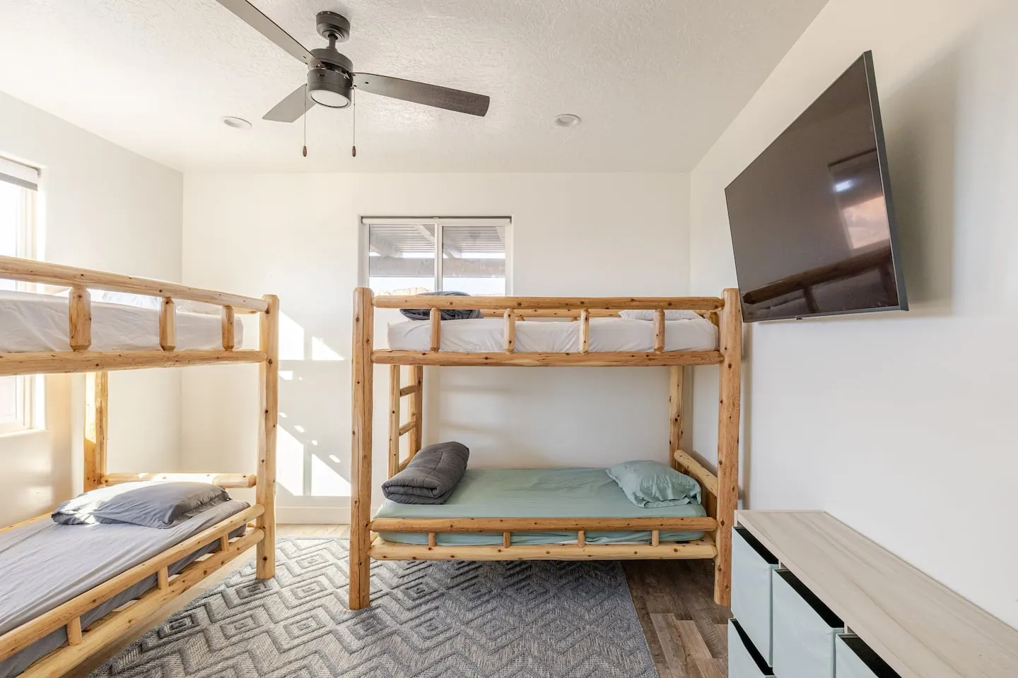 Bunk room with two sets of log bunk beds